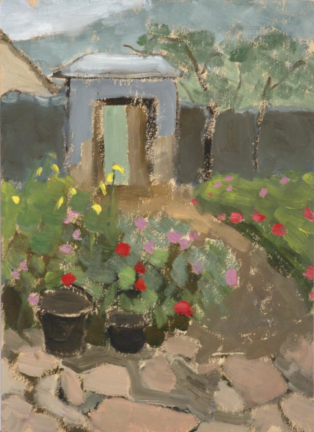 garden with red, pink, and yellow flowers