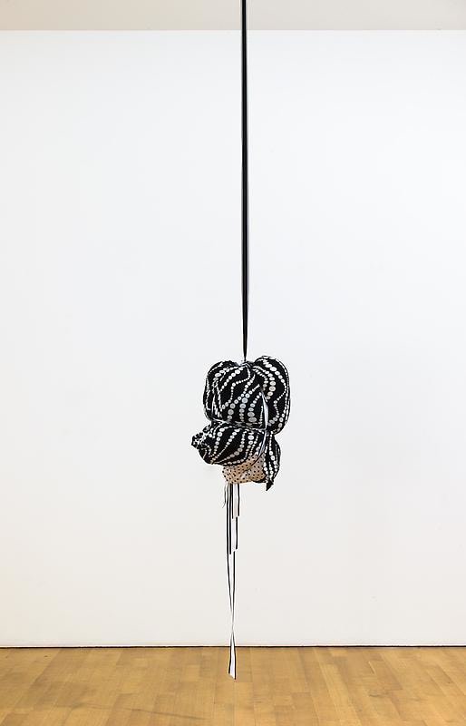 bundle of cloth hanging from the ceiling