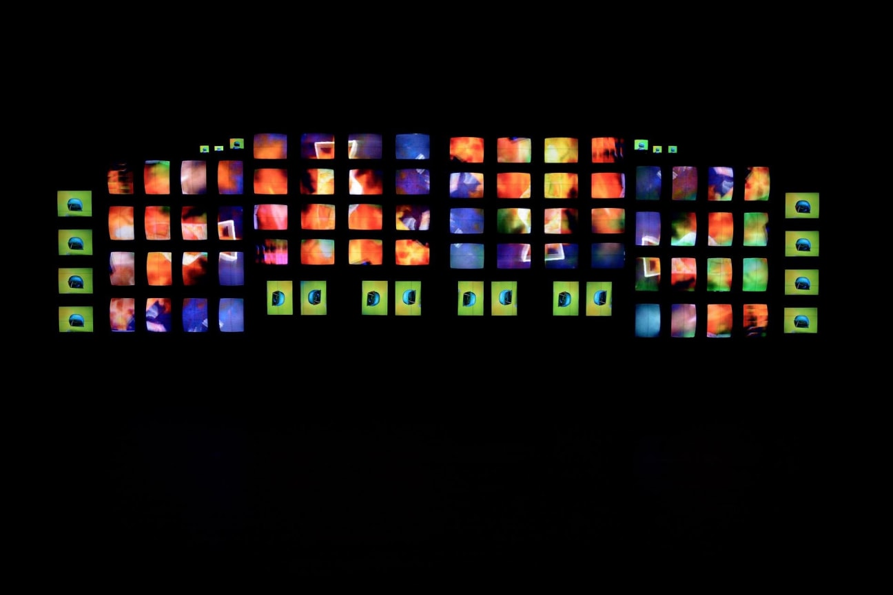 installation view of multiple TV screens