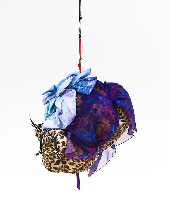 bundle of cloth hanging from the ceiling