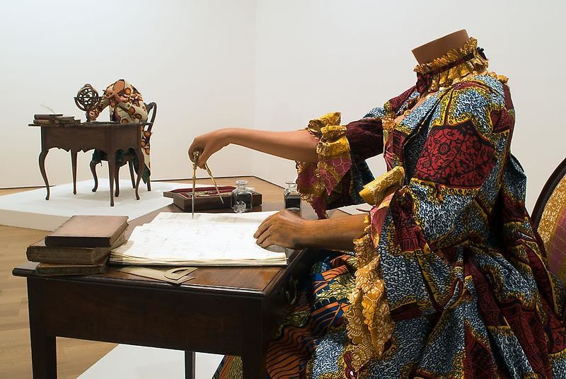 mannequin in a dress using a compass