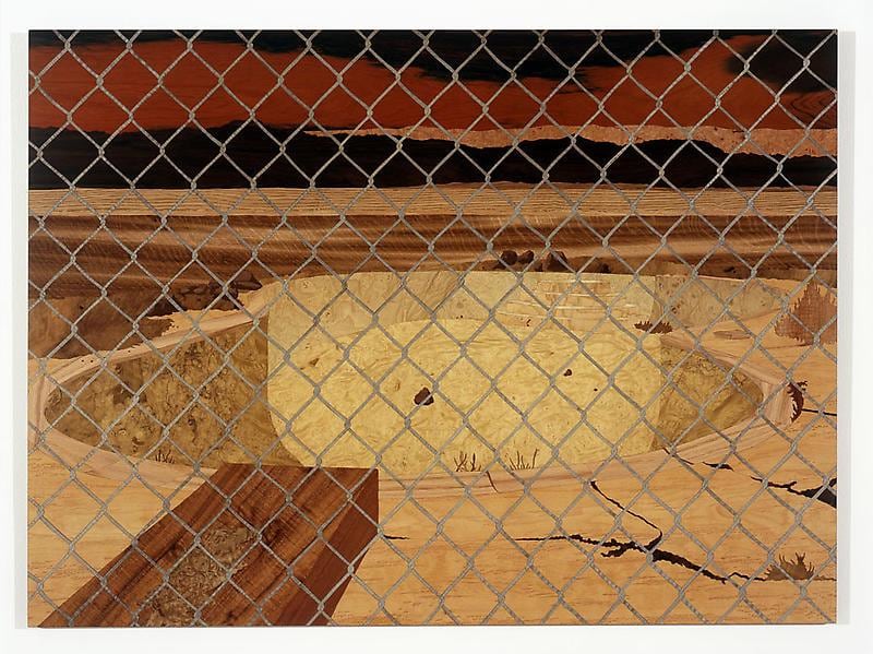 empty pool behind chain link fence