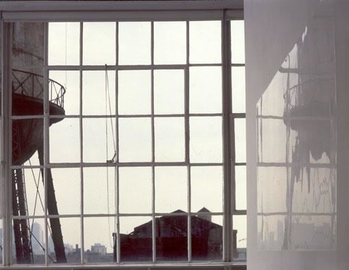 artwork reflecting the city view from outside the gallery's window