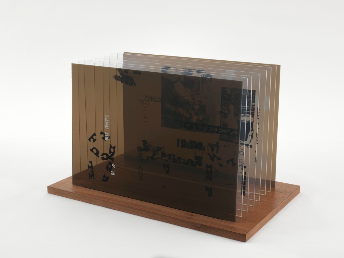 , JOHN CAGE&nbsp;Not Wanting to Say Anything About Marcel Plexigram V,&nbsp;1969&nbsp;Screenprint on eight Plexiglas panels with walnut base&nbsp;14 x 20 x 1/8 in. (35.6 x 50.8 x 0.3 cm)