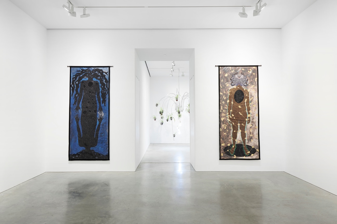 entryway to the next room flanked by two artworks