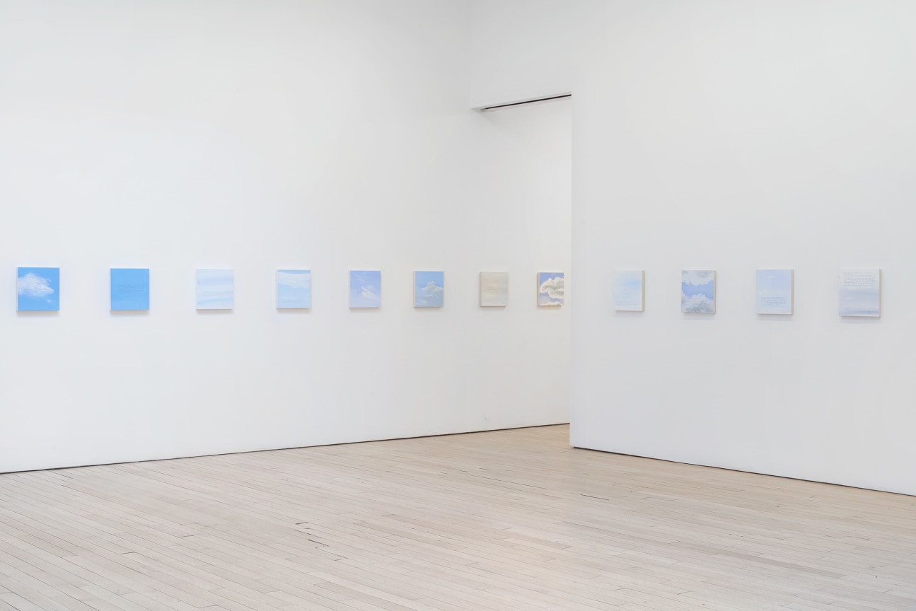 installation view of several square canvases in a row