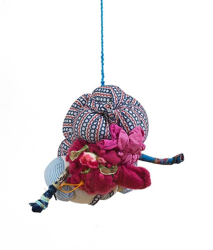 bundle of cloth hanging from the ceiling