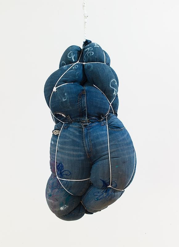 stuffed jeans hanging from the ceiling