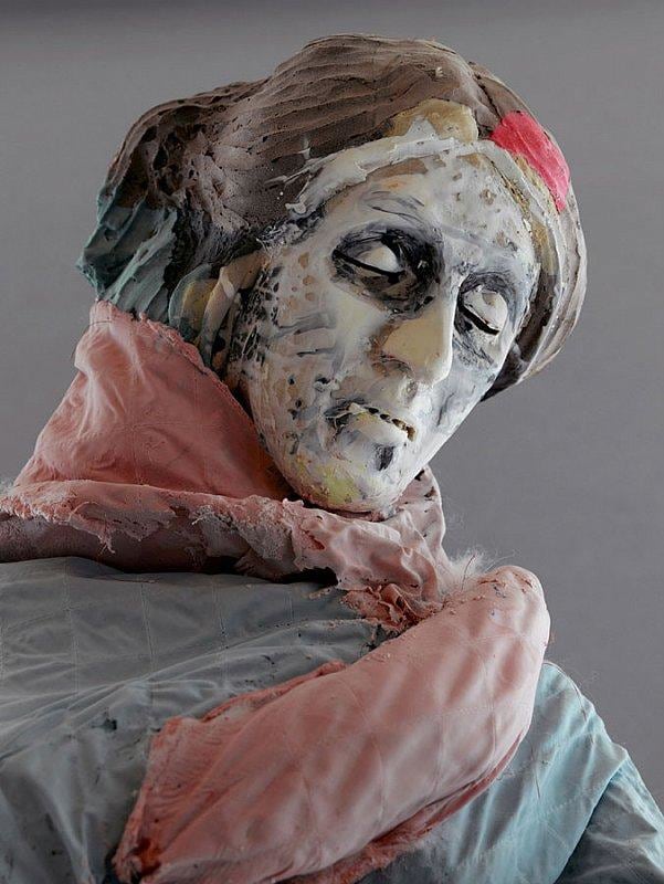 close up of statue wearing a blue robe