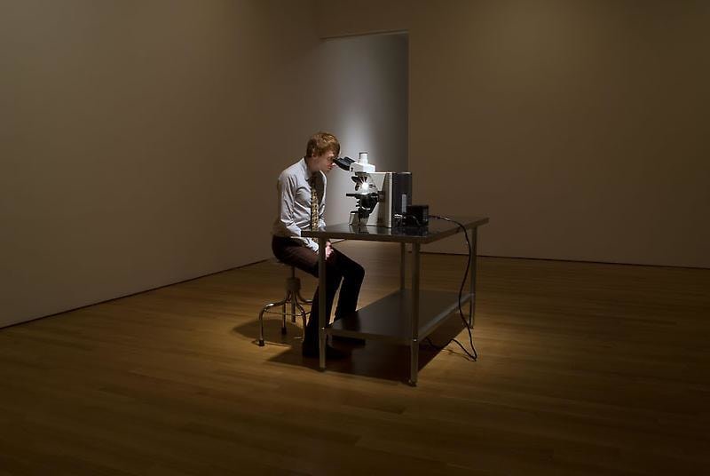 Man looking into a microsope