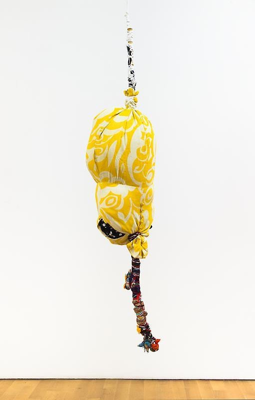 bundle of yellow cloth hanging from the ceiling