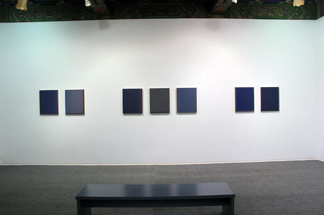 Installation view of several solid color canvases