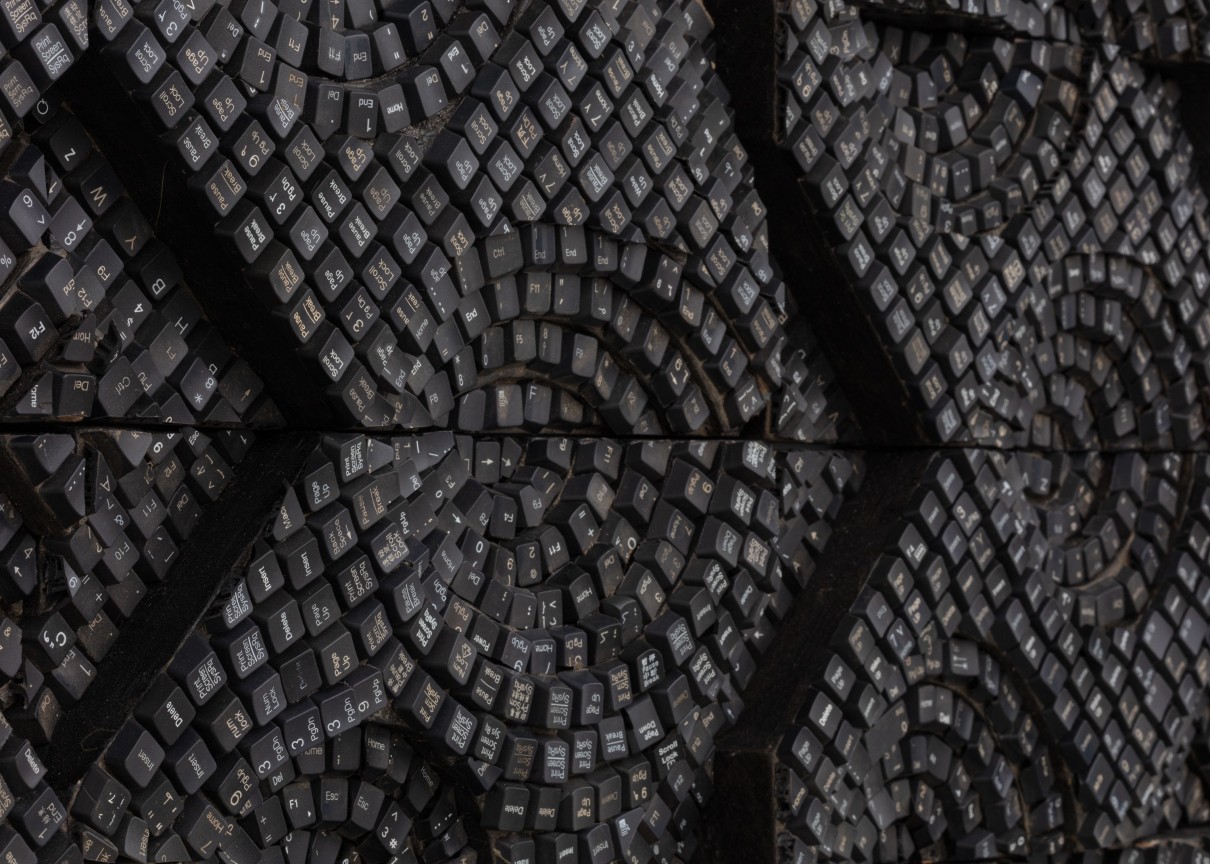 detail of panel containing keyboard keys forming various geometric shapes