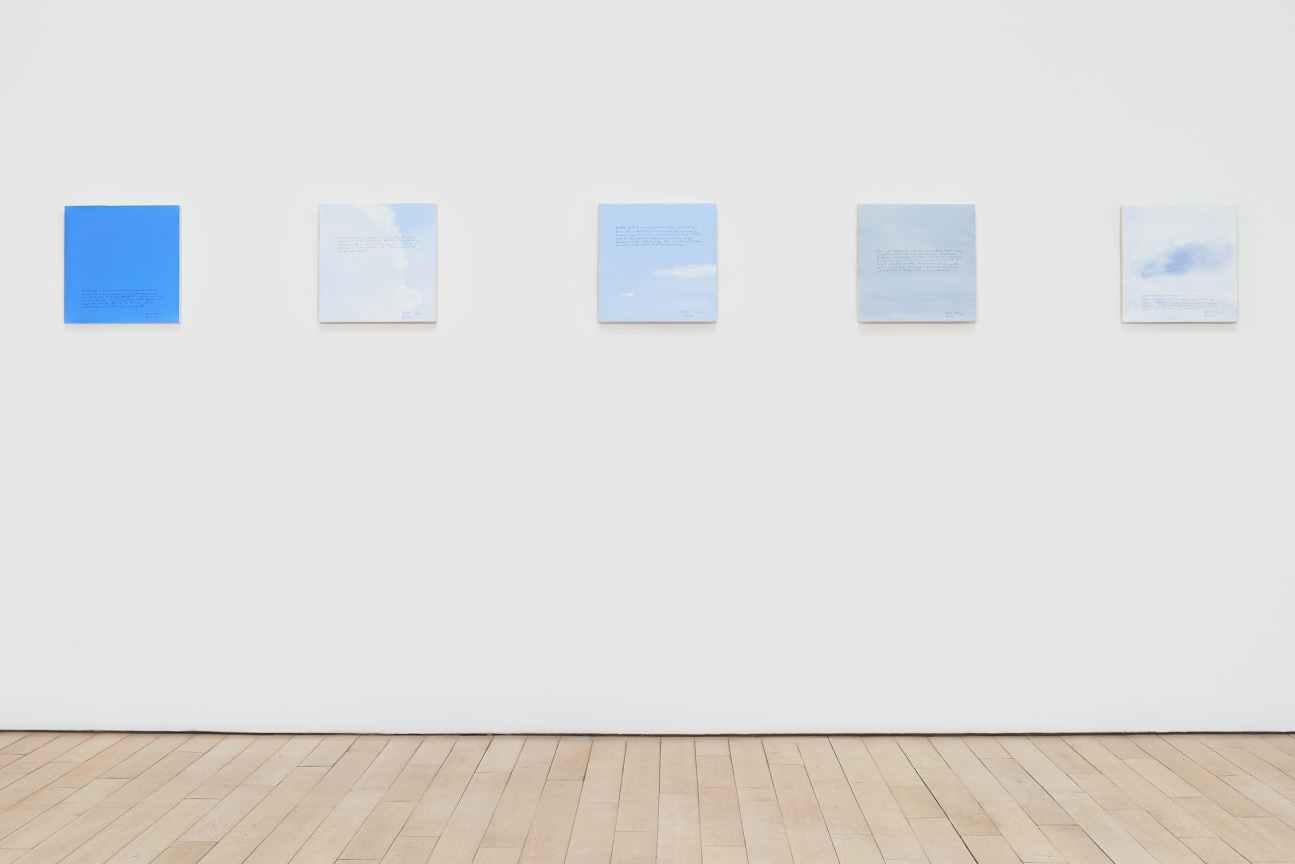installation view of several square canvases in a row
