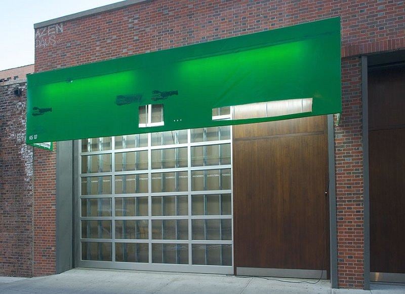 James Cohan Gallery with a new green tarp masking its true identity as a gallery