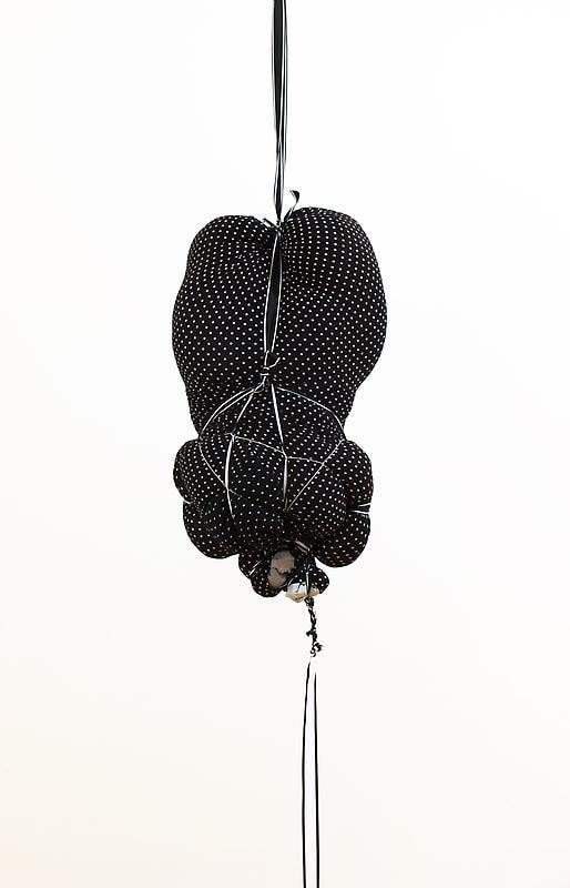 bundle of cloth hanging from the ceiling