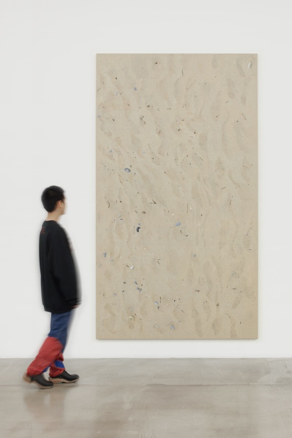 Person walking up to an artwork