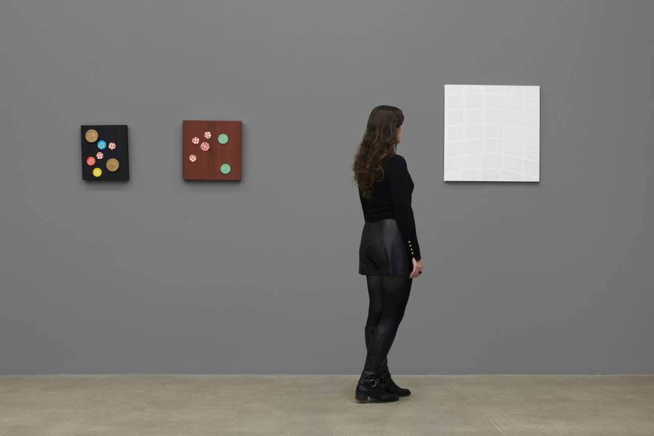 person observing a white artwork