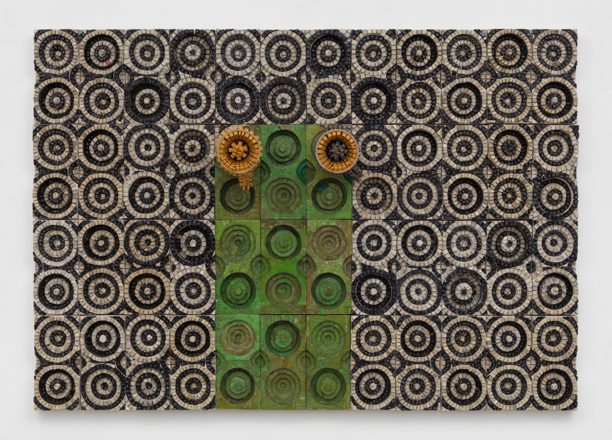 two megaphones emerging from a panel covered in electrical components