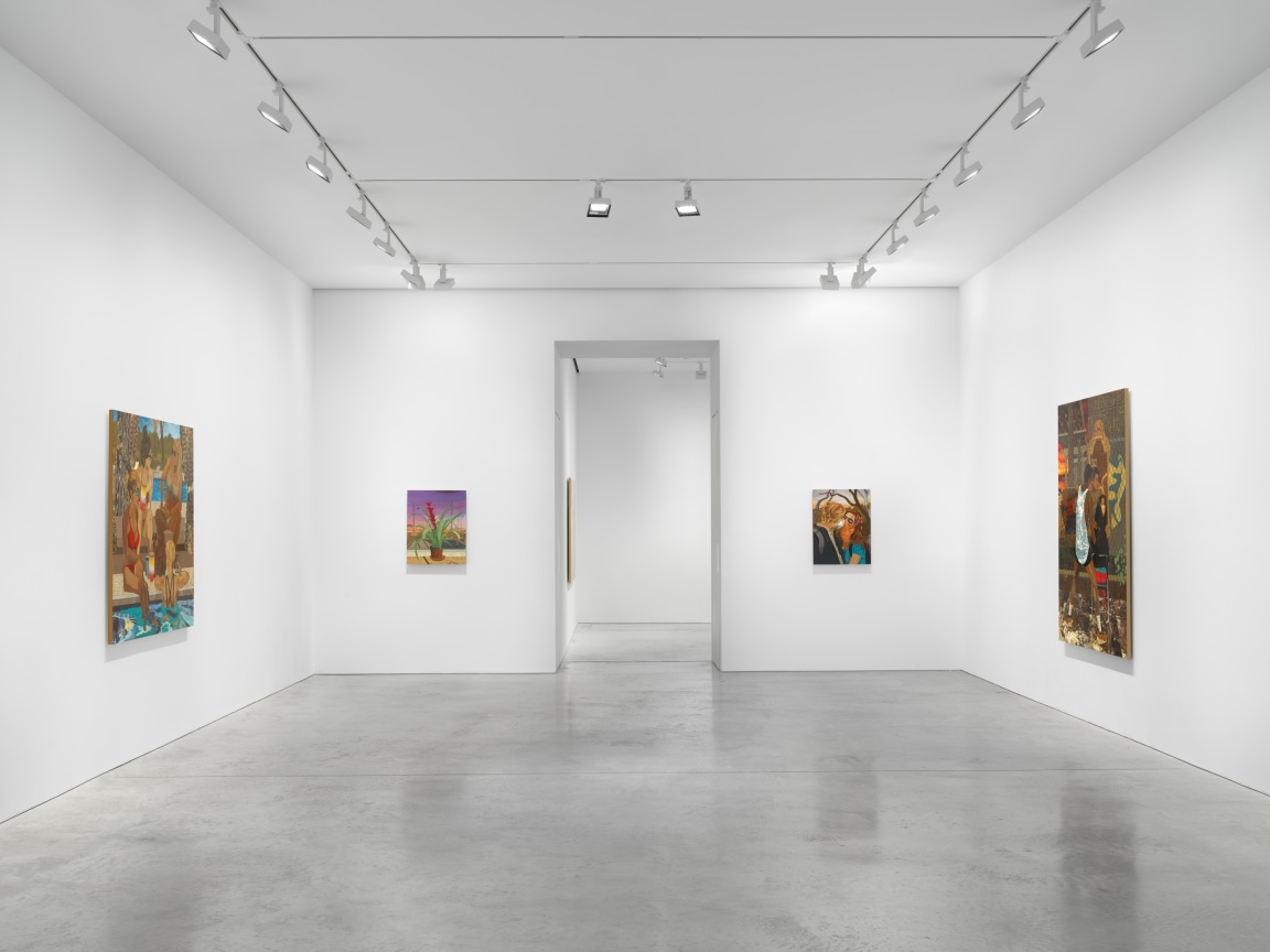 gallery with several artworks with an entryway in the center that leads to another room with art