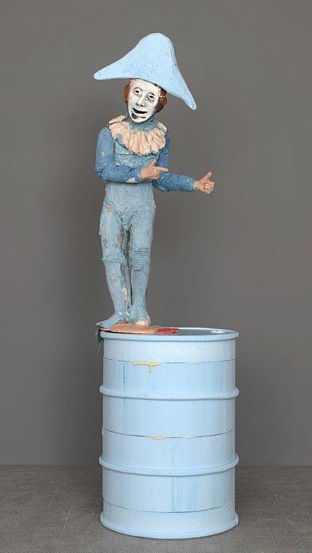 short man standing on a barrel