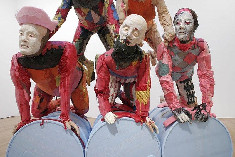 close up of statues at the bottom of the second human pyramid