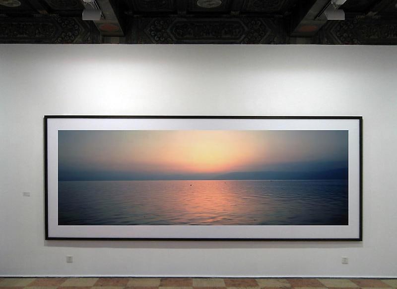 photograph of the dusk sky reflecting on the water