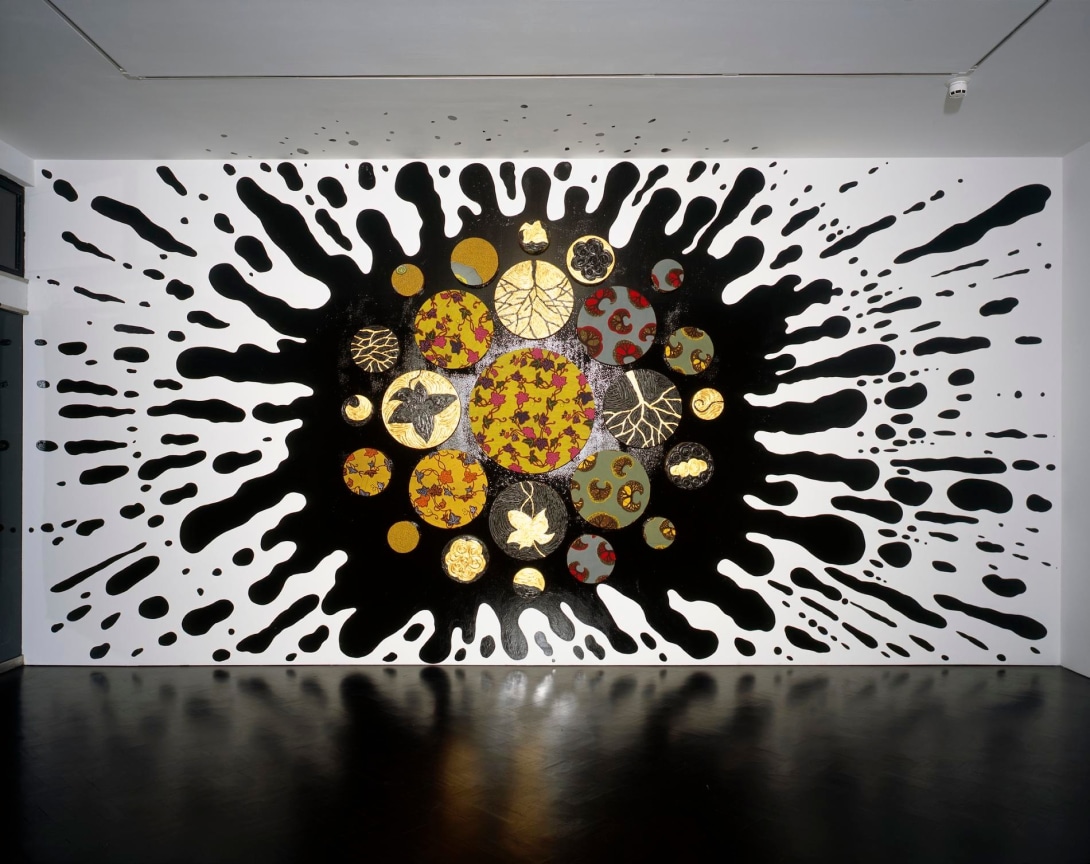 painting of a giant black splatter with multiple circles in the center