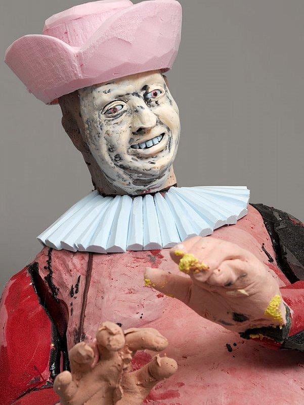 happy statue holding out his hands