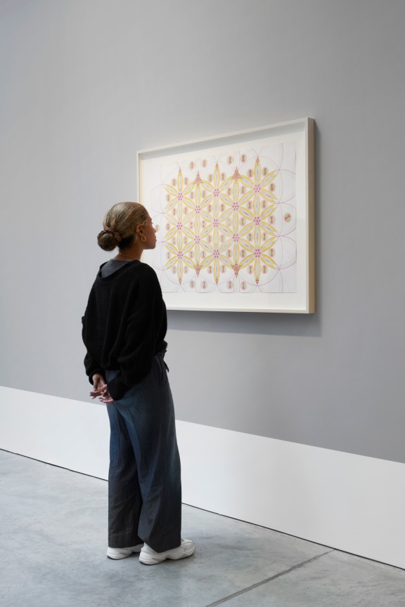 person contemplating a drawing