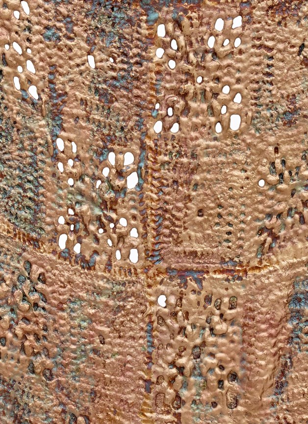 close up of bronze sculpture imitating knitted fabric