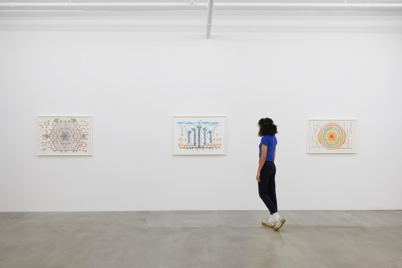 a person observing one of three drawings