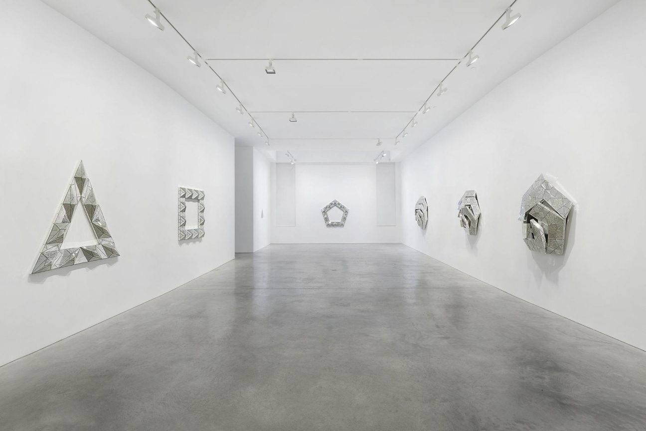 Installation shot of Mirror-works and Drawings by Monir Shahroudy Farmanfarmaian.