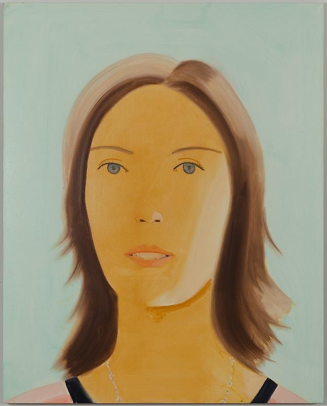 woman with brown hair and blue eyes looking at the viewer