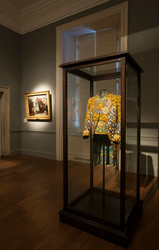 a flamboyant, golden-colored jacket