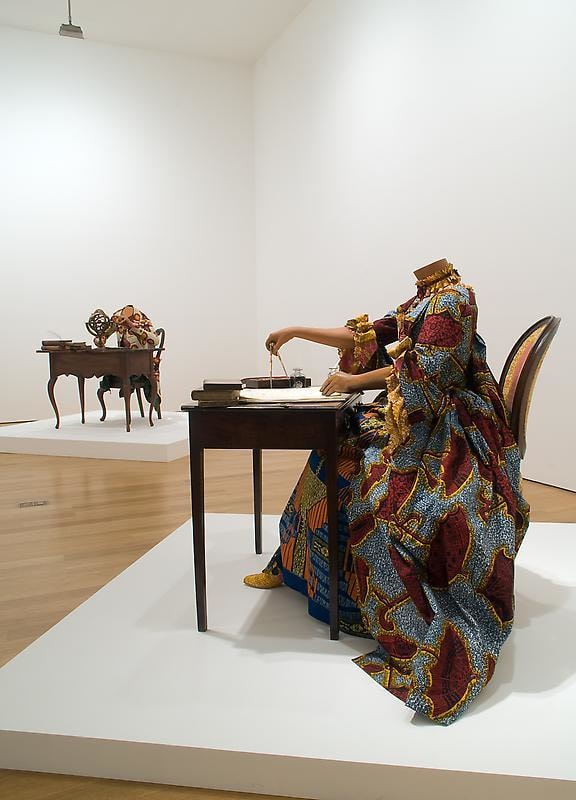 mannequin in a dress using a compass