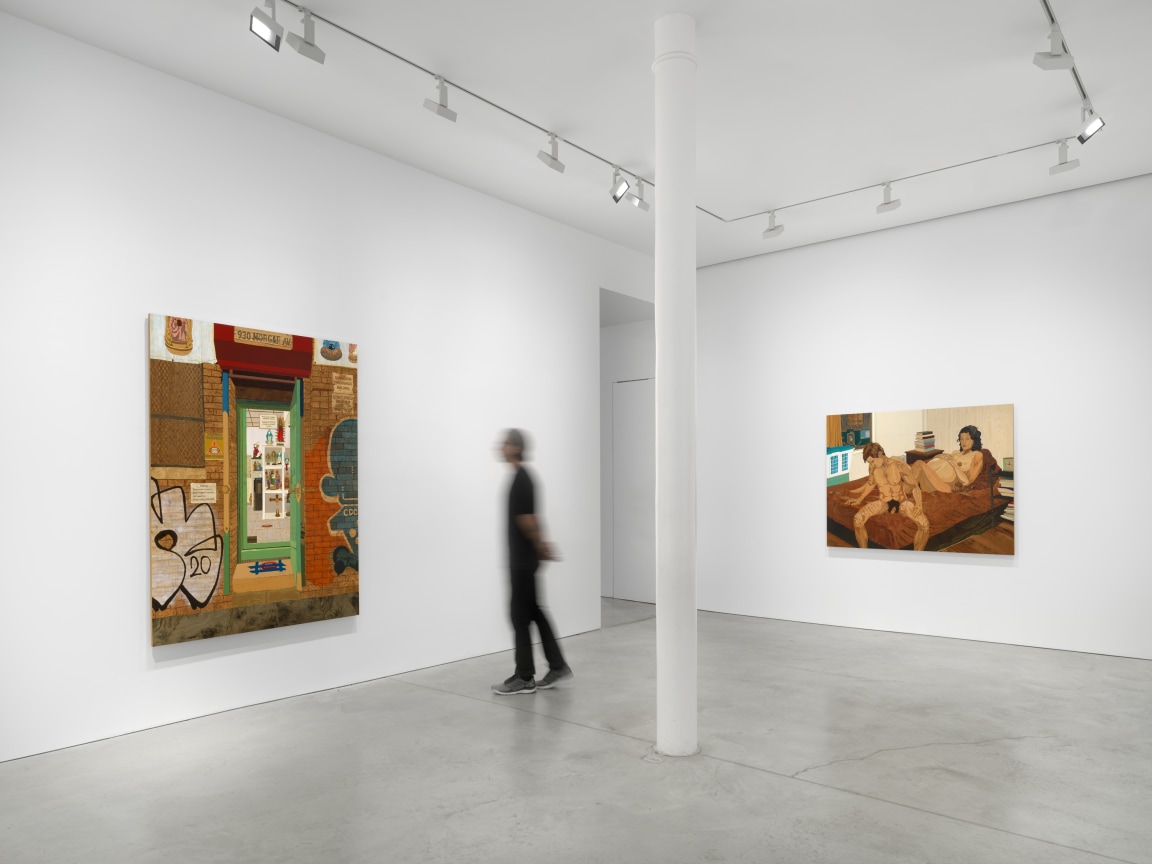 person looking at one of two artworks