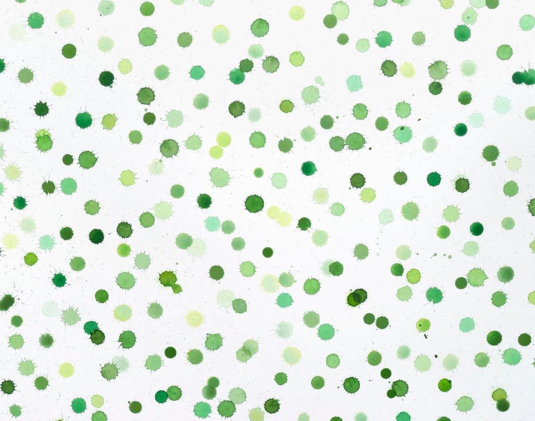 green paint dots on canvas