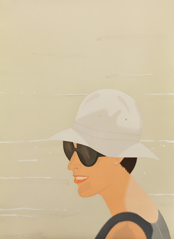 woman with round sunglasses and a white beach hat