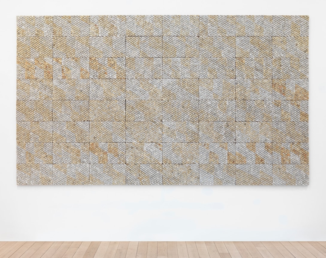 reclaimed electrical wires and components on panel, creating a grayish and yellowish pattern