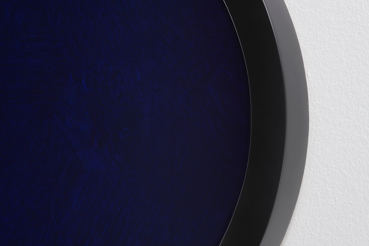 close of oval revealing a deep blue that looks almost black