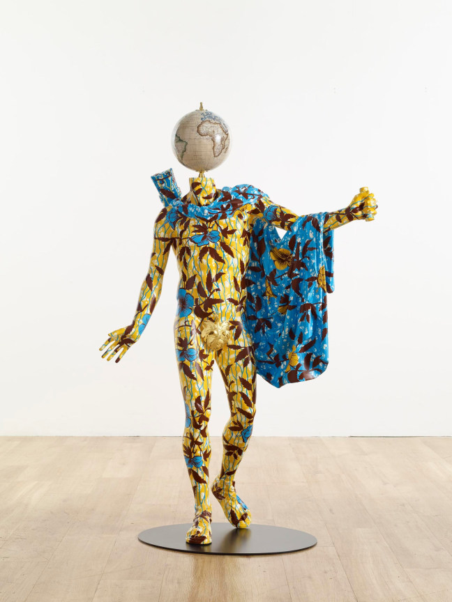 mannequin with painted vines and flowers and with a globe for a head