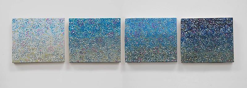 Image of four works getting showing a darker shade of blue with each work