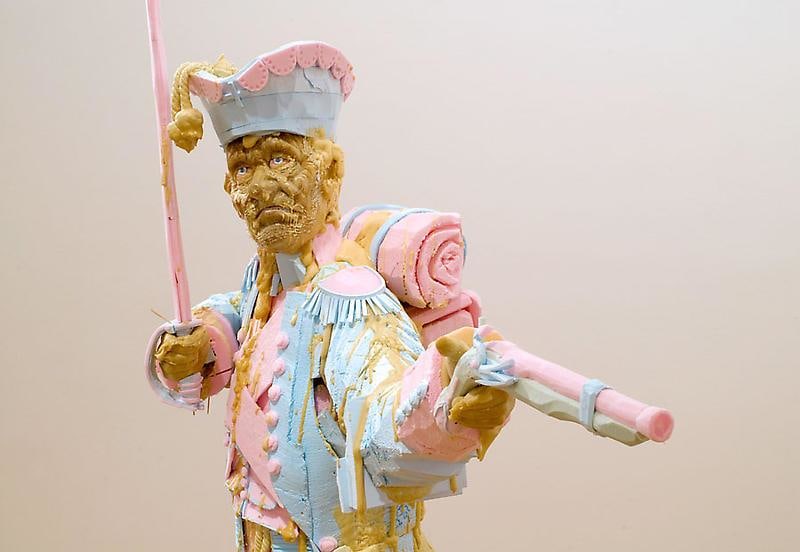 statue holding a gun