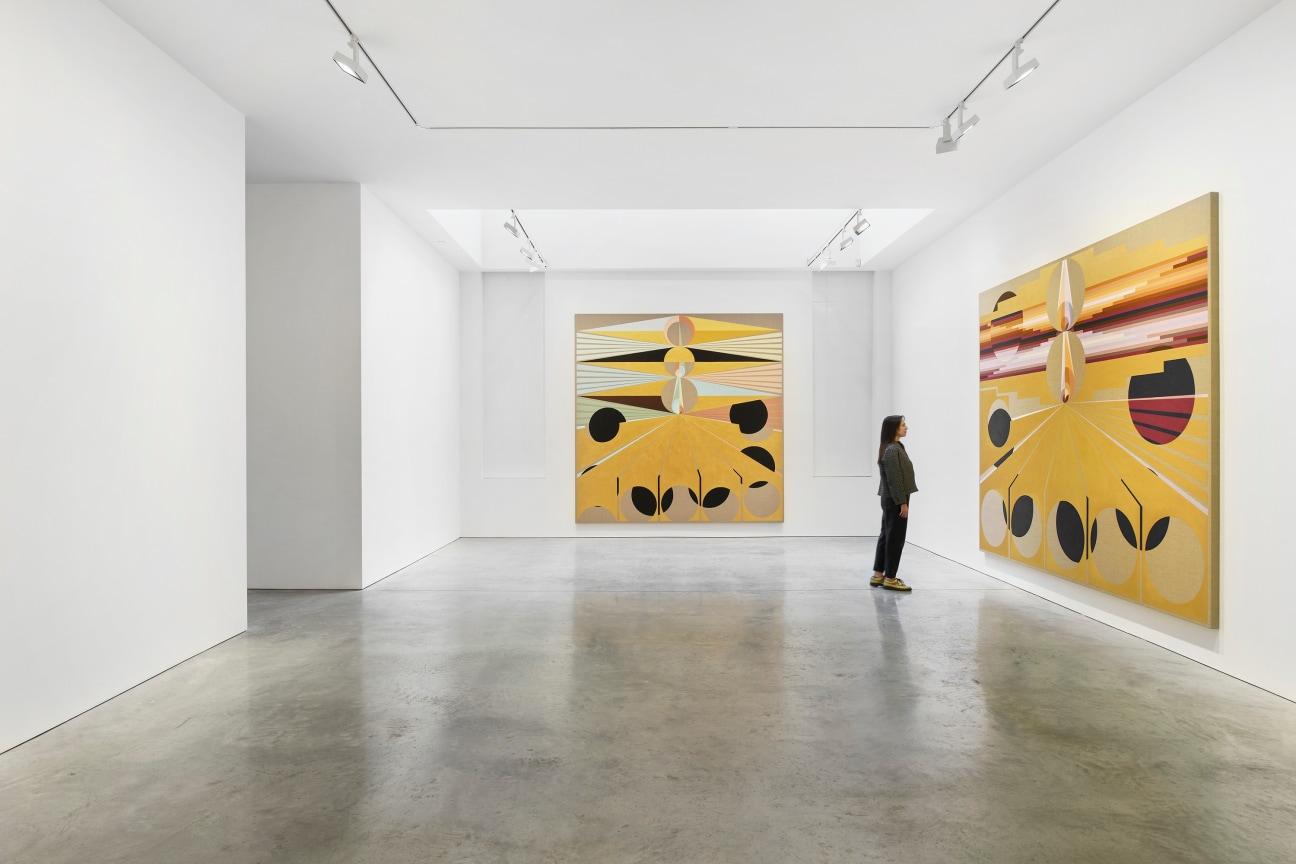 person looking at one of two paintings