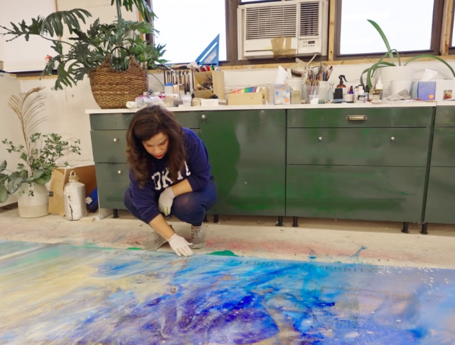 Image inside of Firelei Baez Studio of artist working