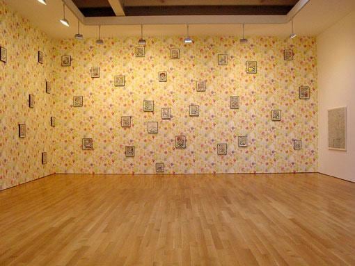 floral wallpaper all over the gallery's walls