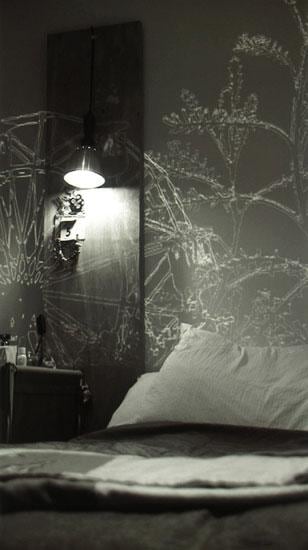 outline of trees and a Ferris wheel superimposed over a bedroom