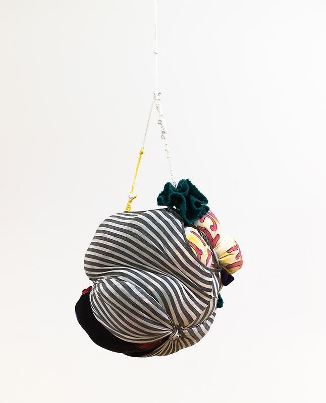 bundle of cloth hanging from the ceiling