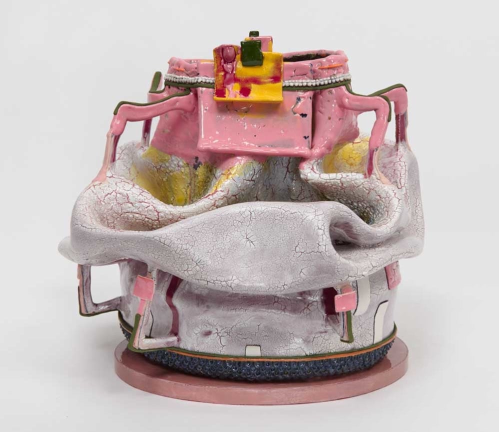 Caved-in clay pot with geometric handles jutting out by Kathy Butterly.